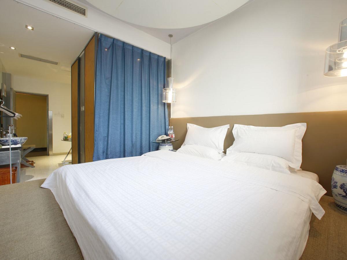 China Community Art Habitat Hotel Čching-tao Pokoj fotografie